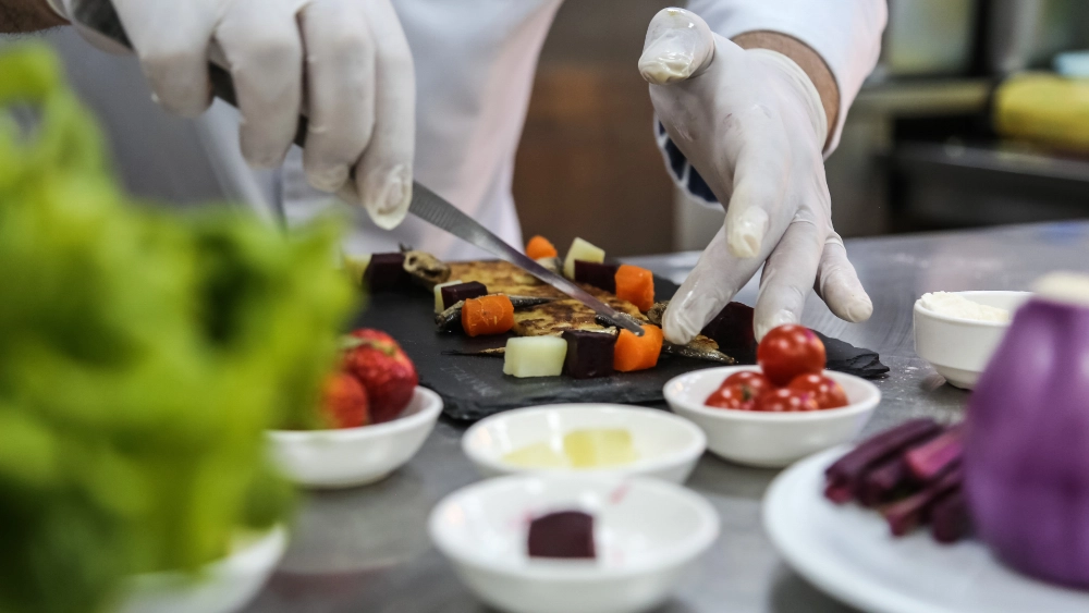 Chef preparing food in a interactive food stations