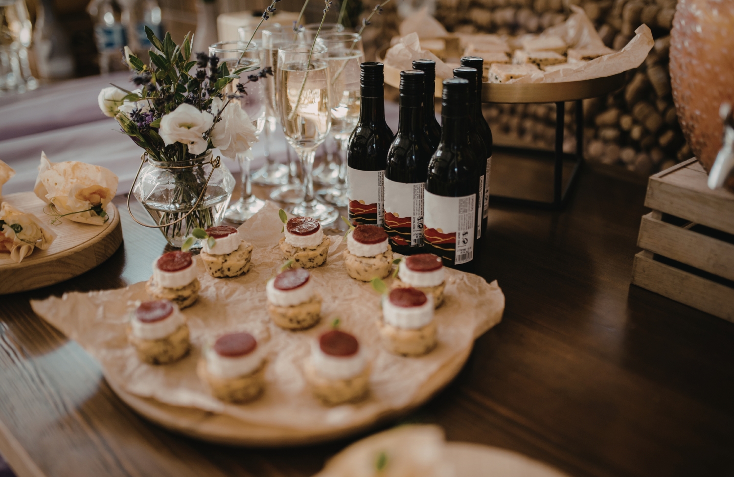 Elegant table spread of shareable bites—small plates, appetizers, and finger foods arranged for a group dinner
